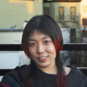 Eight Walls Two Doors by Miaochun Zhang is a 2024 BlueCat Short Film Script Finalist. She was one of five finalists.